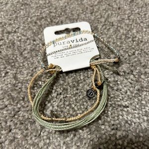 Set of three puravida bracelets.